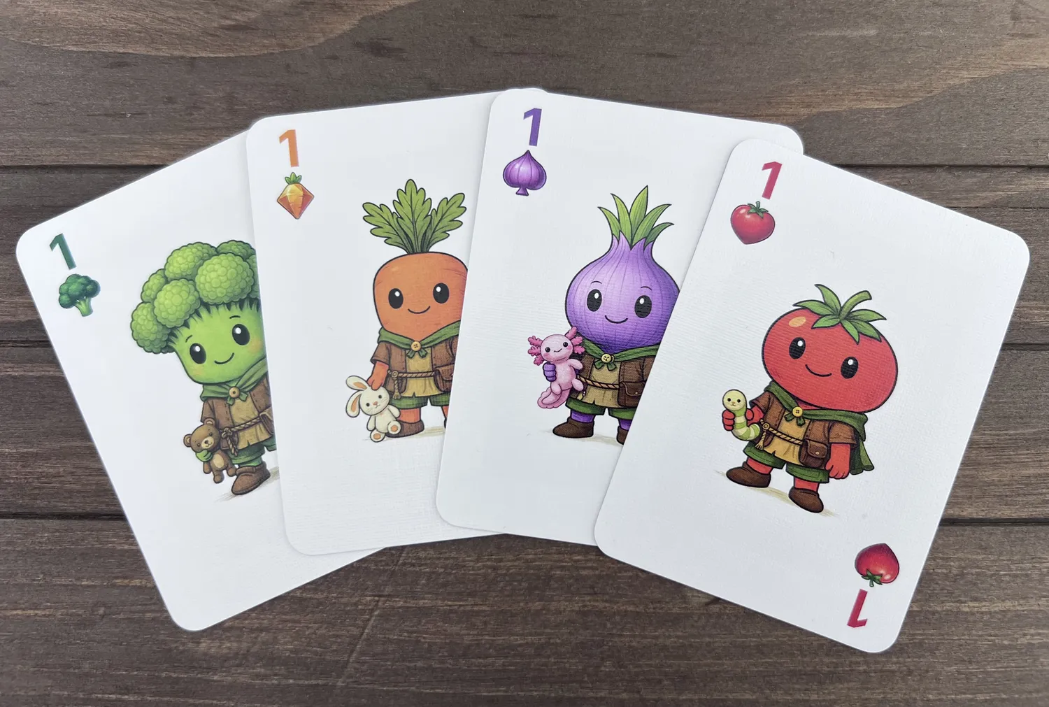 Skip the Salad veggie suit cards fanned out: Broccoli, Carrot, Onion, and Tomato
